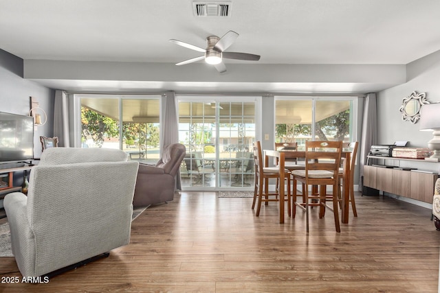 dining room featuring ceiling fan and hardwood / wood-style flooring