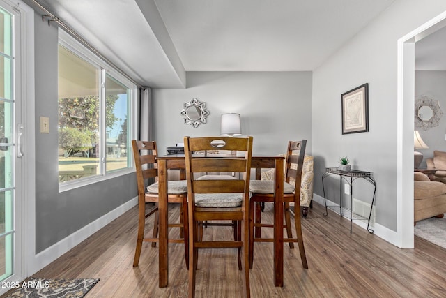 dining space featuring hardwood / wood-style flooring