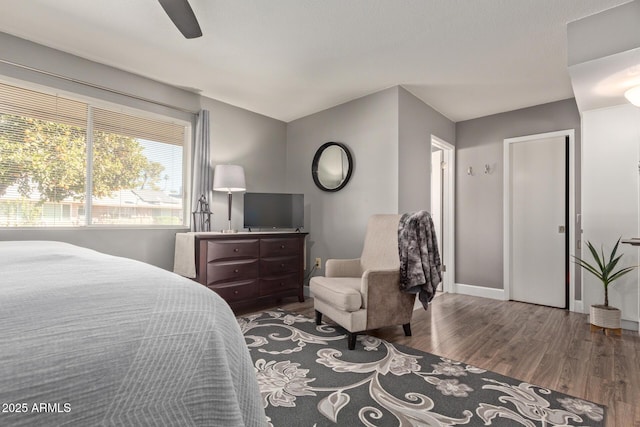 bedroom with wood-type flooring and ceiling fan