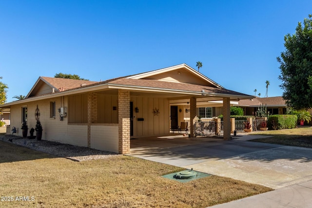 single story home with a carport and a front lawn