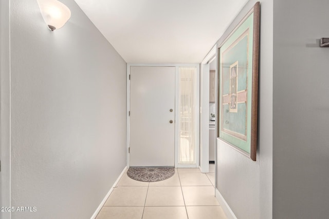 doorway featuring light tile patterned flooring