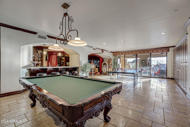 game room with billiards, crown molding, and light tile flooring