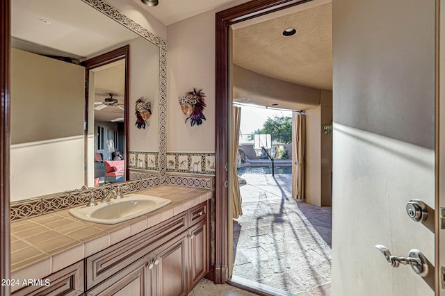 bathroom featuring vanity and ceiling fan