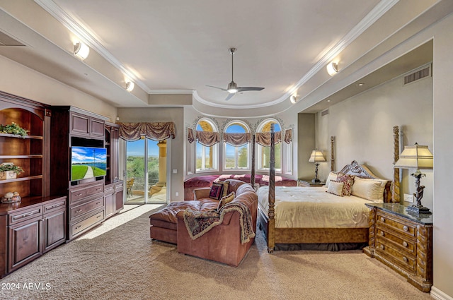 carpeted bedroom with a tray ceiling, ceiling fan, ornamental molding, and access to outside