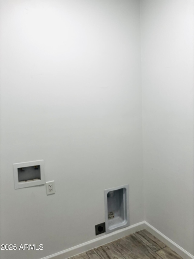 washroom featuring wood finished floors, baseboards, laundry area, and washer hookup