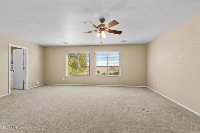 unfurnished room with ceiling fan and light colored carpet