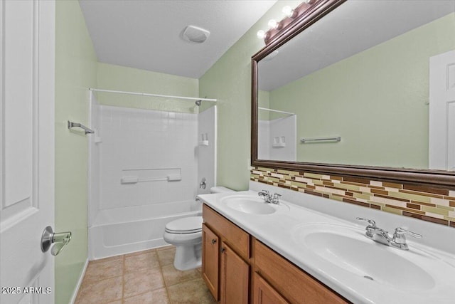 full bathroom featuring shower / washtub combination, tasteful backsplash, tile patterned flooring, vanity, and toilet