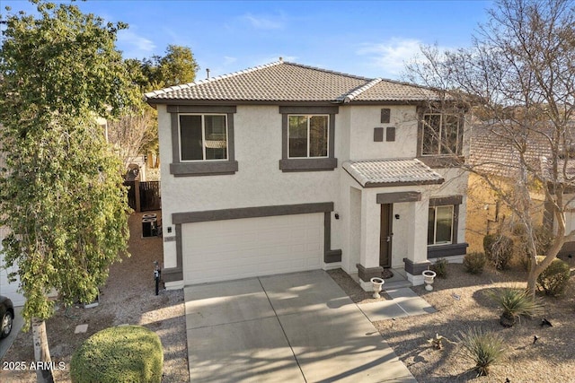 mediterranean / spanish-style house with a garage