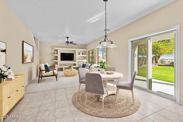 tiled dining area featuring ceiling fan