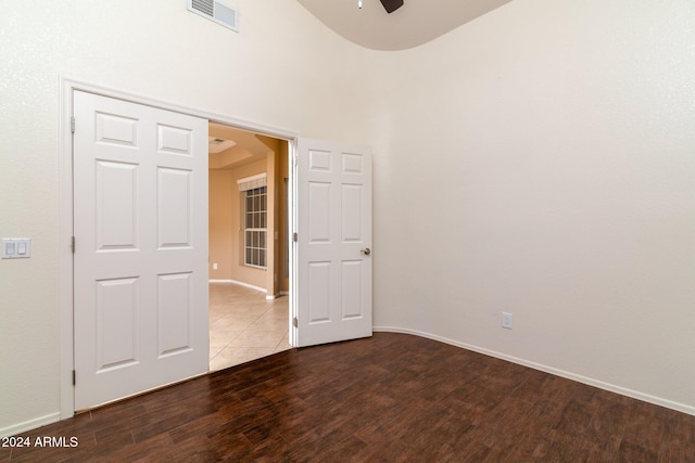 empty room with wood-type flooring and ceiling fan