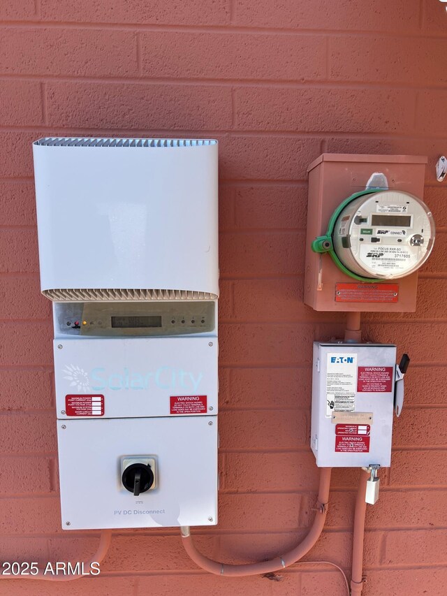 exterior details featuring electric meter