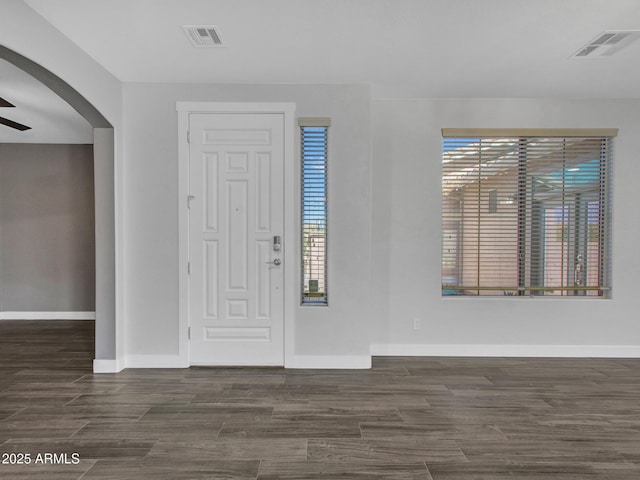 entryway with ceiling fan, visible vents, and a healthy amount of sunlight