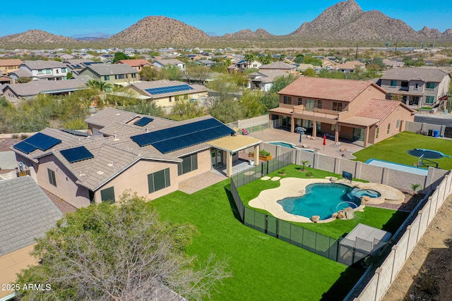 drone / aerial view featuring a residential view and a mountain view