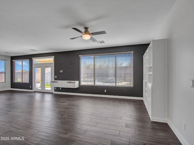 interior space with wood finish floors, visible vents, and plenty of natural light