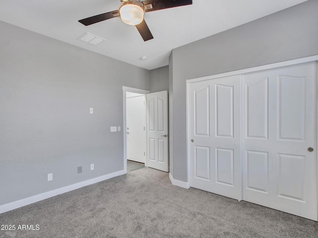 unfurnished bedroom featuring carpet floors, a closet, visible vents, ceiling fan, and baseboards