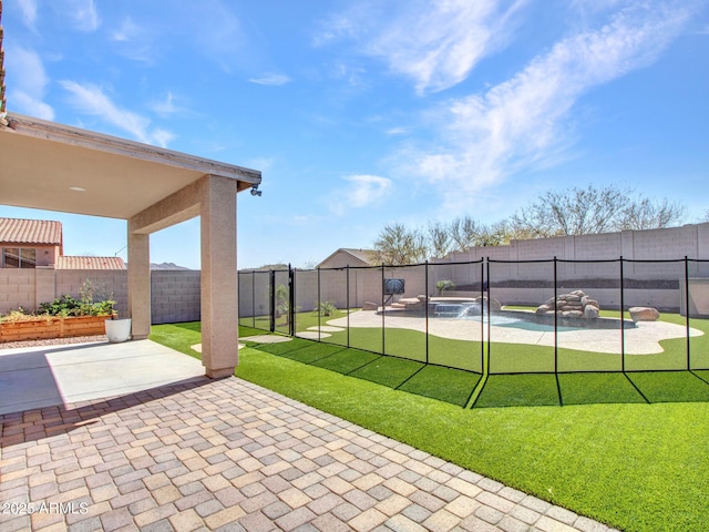 exterior space featuring a fenced backyard, a patio, and a lawn