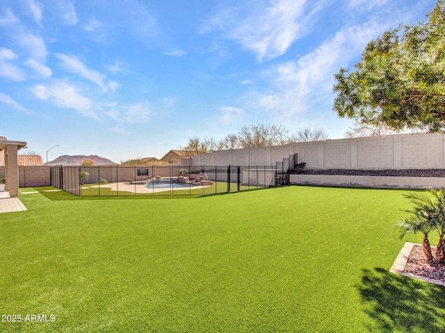 view of yard featuring a fenced in pool and a fenced backyard