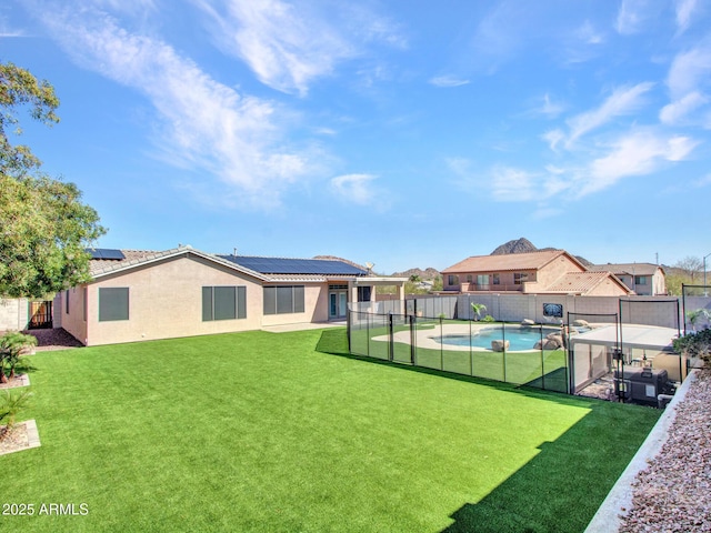 view of yard with a fenced backyard, a fenced in pool, and a patio