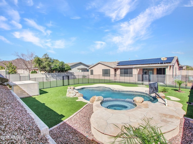 view of swimming pool with a lawn, a patio area, a fenced backyard, and a pool with connected hot tub