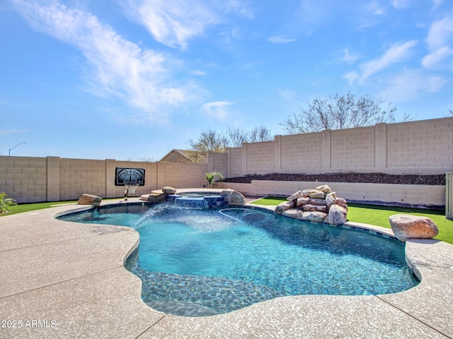 view of swimming pool featuring a pool with connected hot tub and a fenced backyard