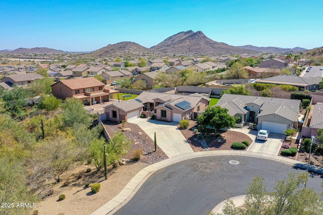 drone / aerial view featuring a residential view and a mountain view