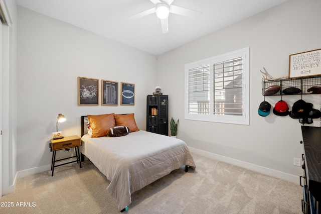 bedroom featuring a ceiling fan, baseboards, and carpet