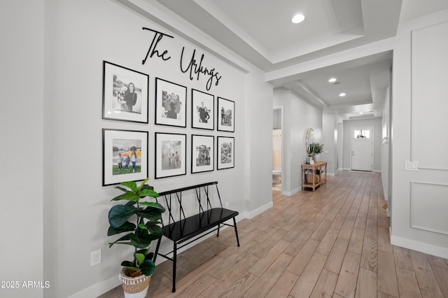 hallway with light wood-style floors, recessed lighting, and baseboards