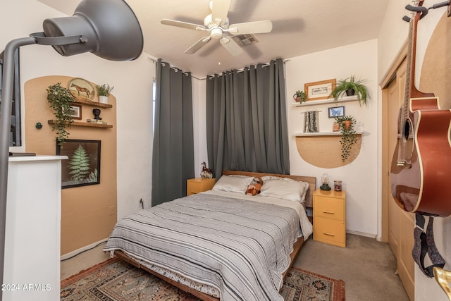 bedroom featuring ceiling fan and light colored carpet