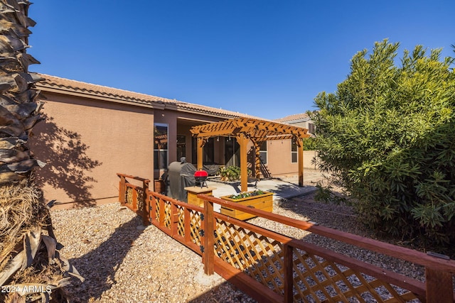 exterior space with a pergola and a patio