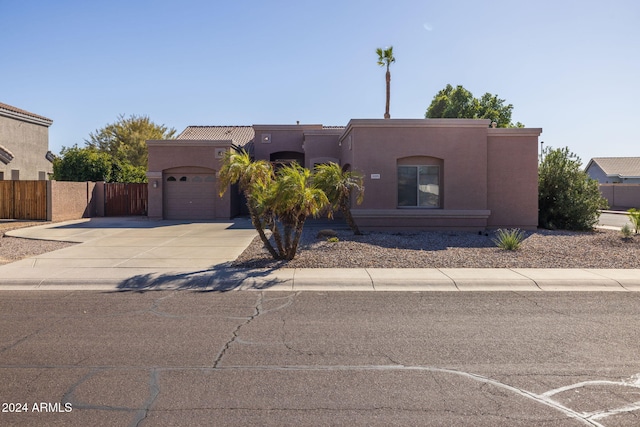 southwest-style home with a garage