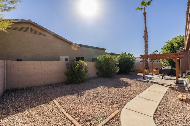 view of yard featuring a pergola and a patio