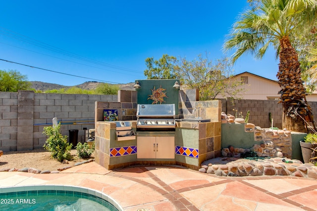 1326 W Joan De Arc Ave, Phoenix, AZ 85029 - view of patio / terrace featuring an outdoor kitchen