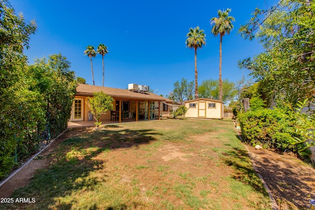 1326 W Joan De Arc Ave, Phoenix, AZ 85029 - view of yard with a storage unit and a patio