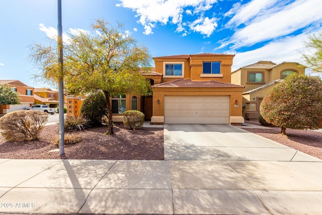 view of front of home featuring stucco siding, a garage, concrete driveway, and a tile roof