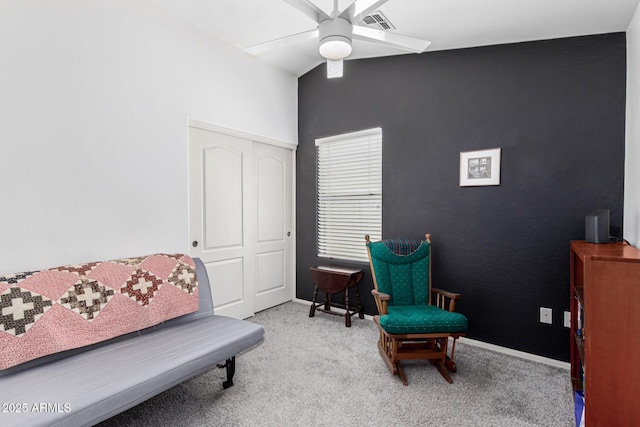 living area with visible vents, baseboards, ceiling fan, and carpet flooring