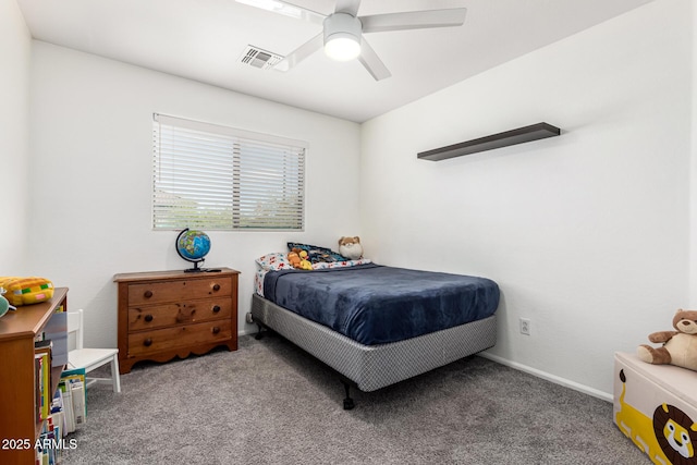 carpeted bedroom with visible vents, baseboards, and a ceiling fan