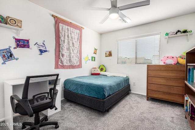 carpeted bedroom with baseboards and ceiling fan