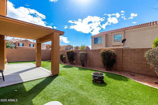 view of yard with a fenced backyard and a patio