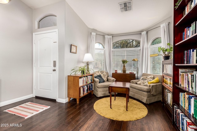 sitting room featuring dark wood finished floors, visible vents, and baseboards