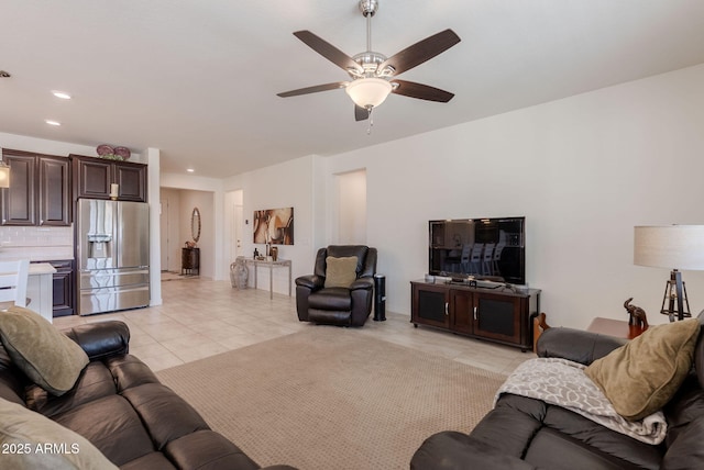 living room with light tile patterned floors, recessed lighting, and a ceiling fan