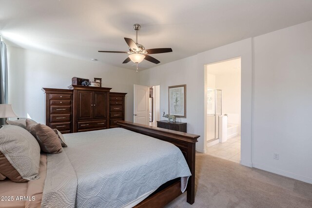 bedroom featuring ensuite bath, ceiling fan, and light carpet