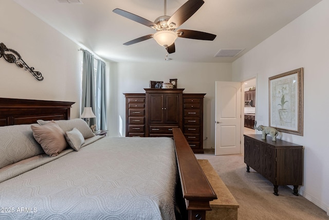 bedroom with light carpet, baseboards, visible vents, and a ceiling fan
