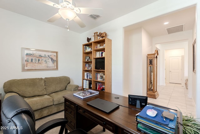 office area with ceiling fan, visible vents, and light tile patterned floors