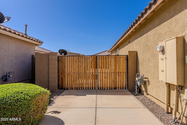 view of gate with fence