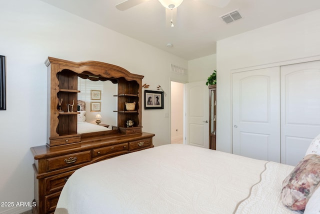 bedroom with a closet, ceiling fan, and visible vents