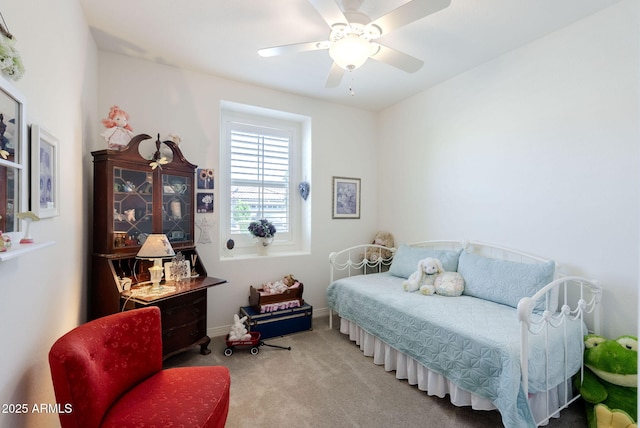 bedroom featuring baseboards, carpet flooring, and a ceiling fan