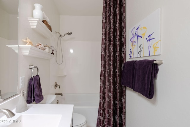 full bath with toilet, a sink, and shower / bath combo with shower curtain