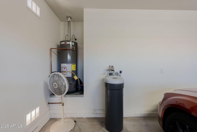 utilities featuring water heater and visible vents