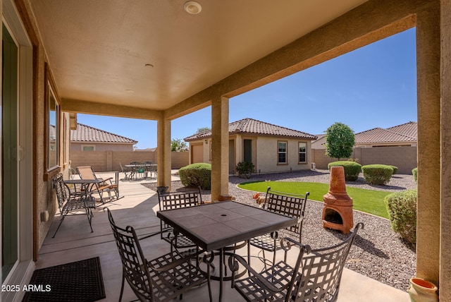 view of patio with a fenced backyard and outdoor dining space