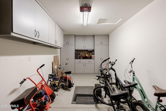 exercise area featuring a textured ceiling